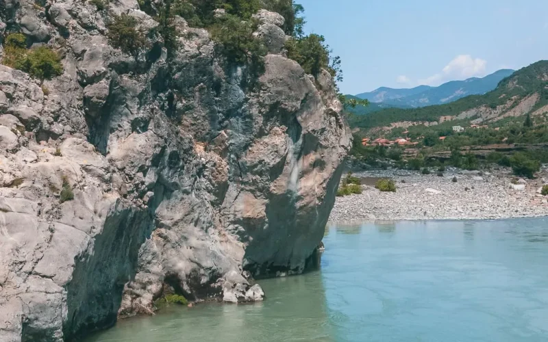 Kayakers on the calm blue water of the river
