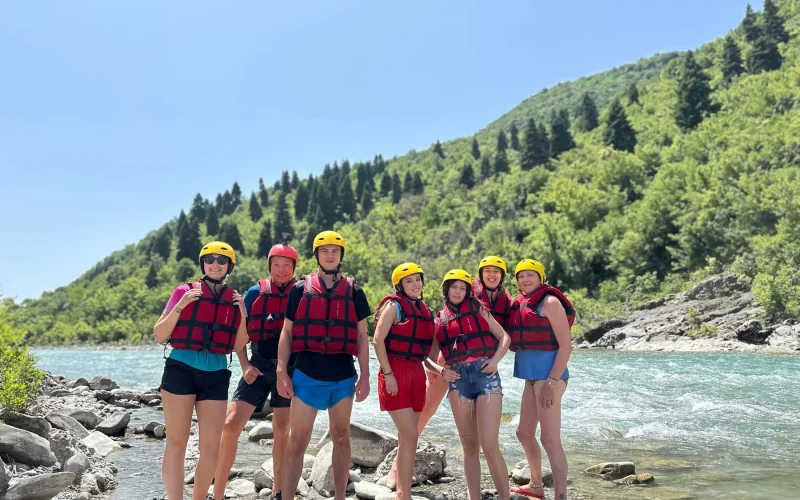Friends enjoying a sunny river day in Albania